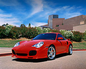 POR 04 RK0495 02
2003 Porsche Turbo X-50 Red Low 3/4 Front View On Pavement Bushes Background