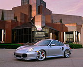 POR 04 RK0513 03
2003 Porsche Turbo 911 Silver 3/4 Side View On Pavement By Museum