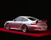 POR 04 RK0551 04
2004 Porsche X50 Turbo Silver 3/4 Rear View On Red Floor Studio