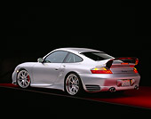 POR 04 RK0552 03
2004 Porsche X50 Turbo Silver 3/4 Rear View On Red Floor Gray Line Studio