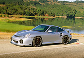 POR 04 RK0560 02
2002 Porsche 996 Turbo Silver 3/4 Front View On Road By Water And Trees