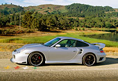 POR 04 RK0561 05
2002 Porsche 996 Turbo Silver Profile View On Road By Water And Trees