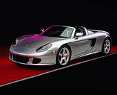 POR 04 RK0568 05
2004 Porsche Carrera GT Convertible Silver 3/4 Front View On Red Floor Gray Line Studio