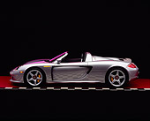 POR 04 RK0571 03
2004 Porsche Carrera GT Silver Profile On Gray Line Red Floor Studio