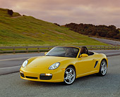 POR 04 RK0587 01
2004 Porsche Boxster S Convertible Yellow 3/4 Front View On Road By Grass Hills Filtered