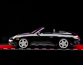 POR 04 RK0617 04
2005 Porsche 911 S Carrera Convertible Black Profile View On Red Floor Checkered Line Studio