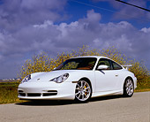 POR 04 RK0622 02
2005 Porsche 911 GT3 Coupe White Low 3/4 Front View On Pavement By Yellow Flower Bush