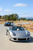 POR 04 RK0646 01
2005 Porsche Boxster S Police Car Watching 2005 Porsche Carerra GT Silver Drive Away On Road