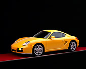 POR 04 RK0647 01
2006 Porsche Cayman S Yellow 3/4 Side View On Red Floor Studio