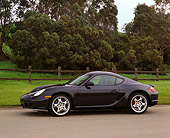POR 04 RK0657 02
2006 Porsche Cayman S Black Side 3/4 View On Pavement By Trees And Grass