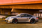 POR 04 RK0675 01
2007 Porsche 911 Turbo Silver 3/4 Front View By Bridge And Water At Sunset