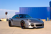 POR 04 RK0688 01
2007 Porsche 911 Turbo Silver 3/4 Front View On Pavement By Building
