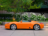 POR 04 RK0692 01
2007 Porsche RUF Spyder Orange Profile View On Pavement By Trees And Flowers