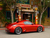 POR 04 RK0698 01
2007 Porsche RUF RK Coupe Red 3/4 Rear View On Pavement Gas Station