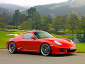 POR 04 RK0700 01
2007 Porsche RUF RK Coupe Red 3/4 Side View On Pavement By Grass And Trees