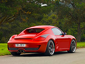 POR 04 RK0701 01
2007 Porsche RUF RK Coupe Red 3/4 Rear View On Pavement By Grass And Trees