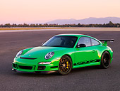 POR 04 RK0755 01
2007 Porsche 911 GT3 RS Green 3/4 Front View On Pavement By Trees Mountain Sky
