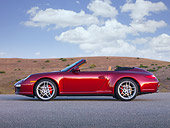 POR 04 RK0816 01
2009 Porsche 911 Carrera 4S Convertible Red Profile View On Pavement By Hills