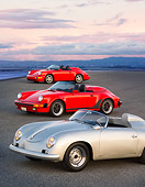 POR 07 RK0123 01
1957, 1989, 1994 Porsche Speedster Convertibles Silver And Red 3/4 Front View On Pavement