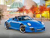 POR 07 RK0126 01
2011 Porsche 911 Speedster Convertible Blue 3/4 Front View On Pavement By Buildings