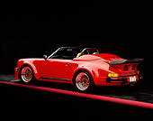 POR 07 RK0003 02
1989 Porsche 911 Speedster Convertible Anniversary Edition Red 3/4 Rear View On Red Line Studio