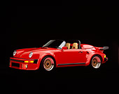 POR 07 RK0006 02
1989 Porsche 911 Speedster Anniversary Edition Convertible Red 3/4 Side View Studio