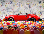 POR 07 RK0055 02
1989 Porsche 911 Speedster Convertible Red Profile View Balloon Floor Studio