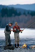 REC 04 DS0005 01
Two Fishermen Standing By Fire On Rocky Lake Shore