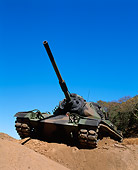 TNK 01 RK0006 04
Camouflage M-60 Tank 3/4 Front View On Dirt Hill By Tree Blue Sky