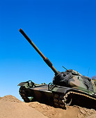 TNK 01 RK0009 01
Camouflage M-60 Tank 3/4 Front View On Dirt Hill Blue Sky
