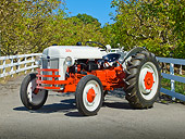 TRA 01 RK0131 01
1939 Ford 9N Tractor White And Red 3/4 Front View On Pavement By Fence And Trees