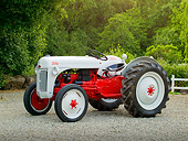 TRA 01 RK0133 01
1948 Ford 8N Tractor White And Red 3/4 Side View On Gravel By Fence And Trees