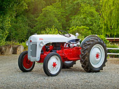 TRA 01 RK0134 01
1948 Ford 8N Tractor White And Red 3/4 Side View On Gravel By Fence And Trees