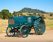 TRA 01 RK0152 01
1918 Sandusky 10-20 Model J  Green 3/4 Rear View On Dirt By Grassy Hills