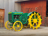 TRA 01 RK0159 01
1925 John Deere Model D Green And Yellow 3/4 Side View On Dirt By Shed