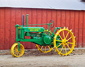 TRA 01 RK0162 01
1935 John Deere Model B Green And Yellow Profile View On Dirt By Shed