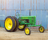 TRA 01 RK0165 01
1940 John Deere HWH Green And Yellow 3/4 Front View On Dirt By Shed