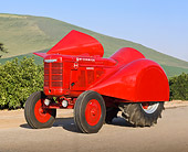 TRA 01 RK0171 01
1949 McCormick Deering Grove Red 3/4 Side View On Pavement By Shrubs