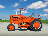TRA 01 RK0181 01
1946 Allis-Chalmers C Tractor Orange Profile View On Pavement By Farm
