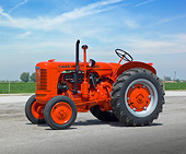 TRA 01 RK0184 01
1943 Case S Tractor Flambeou Red 3/4 Side View On Pavement By Farm