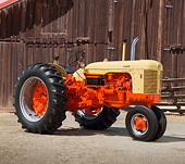 TRA 01 RK0193 01
1957 Case 400 401 Super Diesel Tractor Flambeau Red And Desert Sunset 3/4 Side View On Pavement By Wooden Shed