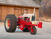 TRA 01 RK0220 01
1958 Ford 950 Tractor Red 3/4 Side View On Gravel By Wooden Shed