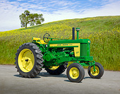 TRA 01 RK0229 01
John Deere 720 Tractor Green And Yellow 3/4 Side View On Pavement By Field Of Wildflowers