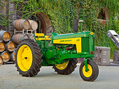 TRA 01 RK0242 01
1959 John Deere 630 Tractor Green And Yellow 3/4 Side View On Pavement By Winery