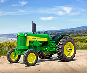 TRA 01 RK0244 01
1960 John Deere 435 Tractor Green And Yellow 3/4 Side View On Dirt By Coast