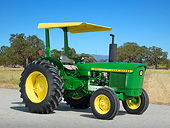 TRA 01 RK0246 01
1979 John Deere 1020 Tractor Green And Yellow 3/4 Side View On Pavement By Dry Grass