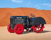 TRA 01 RK0261 01
1929 McCormick-Deering 10-20 Tractor IH Gray 3/4 Side View On Dirt By Red Dirt Pile