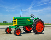 TRA 01 RK0267 01
1953 Oliver Row Crop 66 Tractor Green, Yellow And Red 3/4 Side View On Pavement By Farm