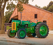 TRA 01 RK0270 01
1957 Oliver Super 55 Tractor Green And Yellow 3/4 Side View On Dirt By Brick Building