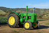 TRA 01 RK0283 01
1980 John Deere Style D Tractor Green And Yellow 3/4 Front View On Dirt At Farm
